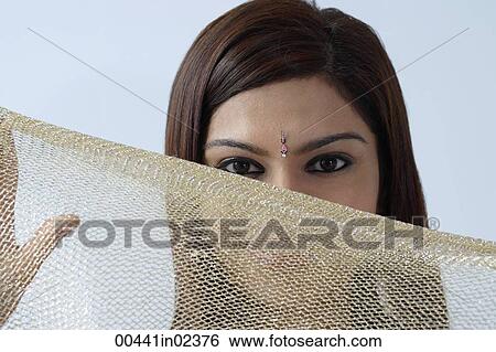Young woman hiding behind veil View Large Photo Image Stock Photograph - Young woman hiding behind veil. Fotosearch
