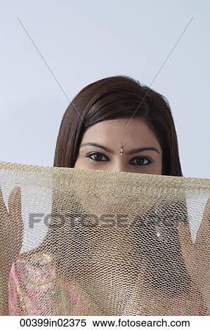 Young woman hiding behind veil View Large Photo Image Stock Photography - Young woman hiding behind veil. Fotosearch