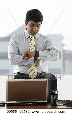business man looking at his watch View Large Photo Image Stock Image - business man looking at his watch. Fotosearch