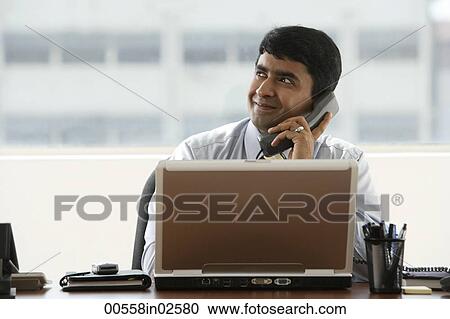 business man talking on office phone View Large Photo Image Stock Image - business man talking on office phone. Fotosearch