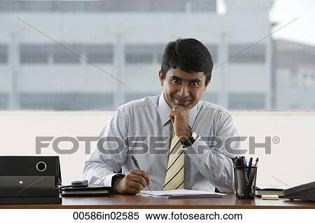 business man writing at his desk View Large Photo Image Stock Photography - business man writing at his desk. Fotosearch