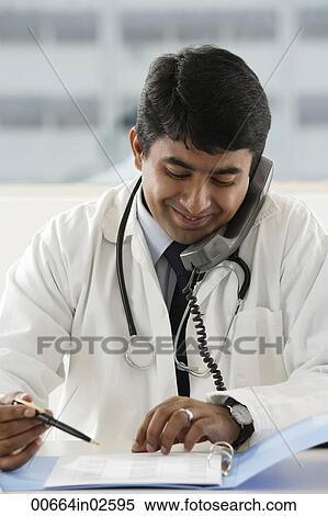 doctor talking on the phone View Large Photo Image Stock Photography - doctor talking on the phone. Fotosearch