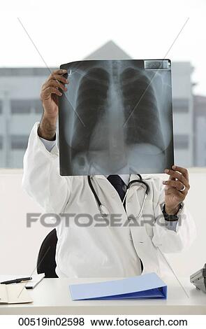 Stock Photo - doctor viewing x-ray. Fotosearch