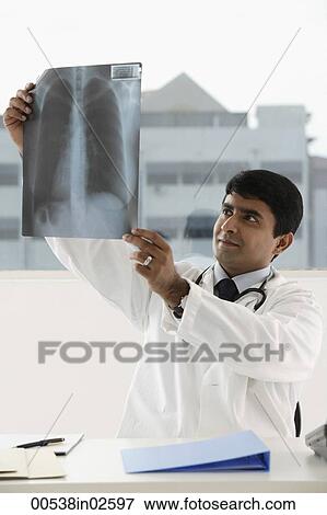 doctor viewing x-ray View Large Photo Image Stock Photo - doctor viewing x-ray. Fotosearch