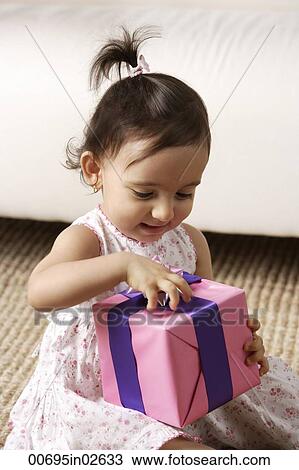 toddler girl opening present View Large Photo Image Stock Image - toddler girl opening present. Fotosearch
