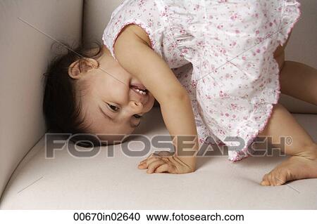 toddler playing on the couch View Large Photo Image Stock Image - toddler playing on the couch. Fotosearch