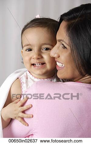 woman carrying baby View Large Photo Image Stock Photo - woman carrying baby. Fotosearch