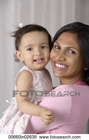 woman carrying baby View Large Photo Image Stock Photo - woman carrying baby. Fotosearch