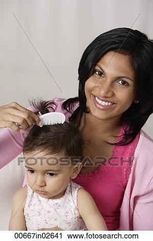 woman combing baby's hair View Large Photo Image Stock Image - woman combing baby's hair. Fotosearch