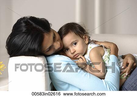 woman cradling baby View Large Photo Image Stock Photograph - woman cradling baby. Fotosearch