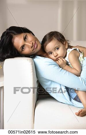 woman cradling baby View Large Photo Image Stock Photography - woman cradling baby. Fotosearch
