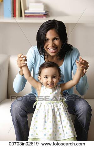 woman holding baby View Large Photo Image Stock Photo - woman holding baby. Fotosearch