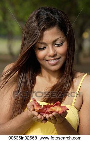 woman looking at flowers View Large Photo Image Stock Photo - woman looking at flowers. Fotosearch