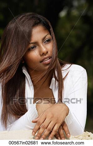 woman lying in sand, looking away View Large Photo Image Stock Image - woman lying in sand, looking away. Fotosearch