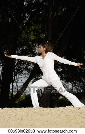 woman practicing yoga outside View Large Photo Image Stock Image - woman practicing yoga outside. Fotosearch