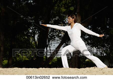 woman practicing yoga outside View Large Photo Image Stock Image - woman practicing yoga outside. Fotosearch