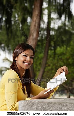 woman reading book outside View Large Photo Image Stock Photograph - woman reading book outside. Fotosearch