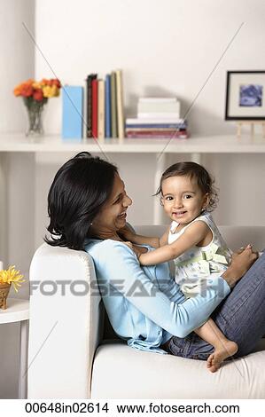woman sitting with baby View Large Photo Image Picture - woman sitting with baby. Fotosearch