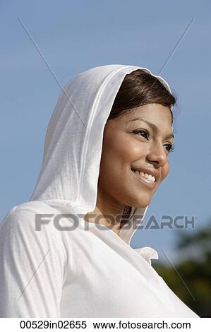 woman wearing hooded sweater, smiling View Large Photo Image Stock Photography - woman wearing hooded sweater, smiling. Fotosearch