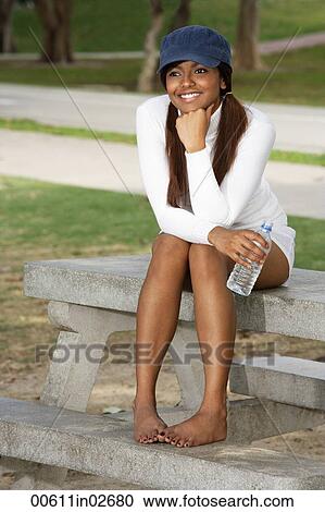 woman with cap, holding water bottle View Large Photo Image Stock Image - woman with cap, holding water bottle. Fotosearch