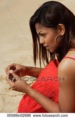 woman with seashells at beach View Large Photo Image Stock Photograph - woman with seashells at beach. Fotosearch