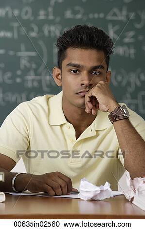 Stock Image - young man with chin on arm. Fotosearch