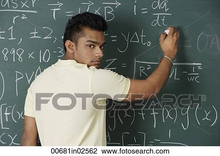 young man writing formulas on chalk board View Large Photo Image Stock Image - young man writing formulas on chalk board. Fotosearch