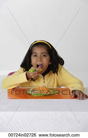 Girl eating briyani rice View Large Photo Image Stock Photograph - Girl eating briyani rice. Fotosearch