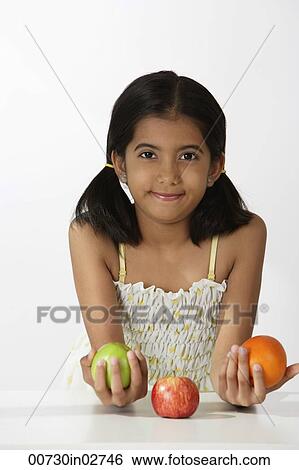 girl holding fruits View Large Photo Image Stock Photograph - girl holding fruits. Fotosearch