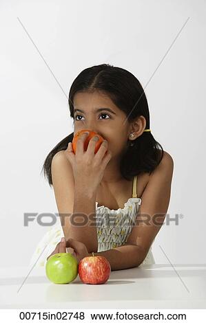 girl smelling orange View Large Photo Image Stock Photo - girl smelling orange. Fotosearch