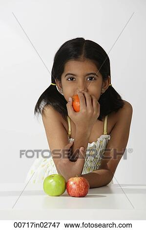 girl smelling orange View Large Photo Image Stock Photo - girl smelling orange. Fotosearch