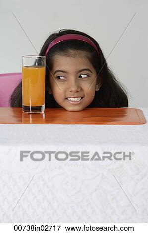 Girl with glass of juice View Large Photo Image Stock Photo - Girl with glass of juice. Fotosearch
