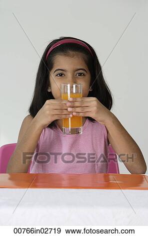 Stock Photo - Girl with glass of juice. Fotosearch