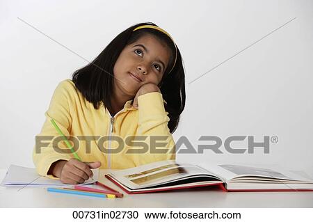 Girl working with color pencils and book View Large Photo Image Stock Image - Girl working with color pencils and book. Fotosearch