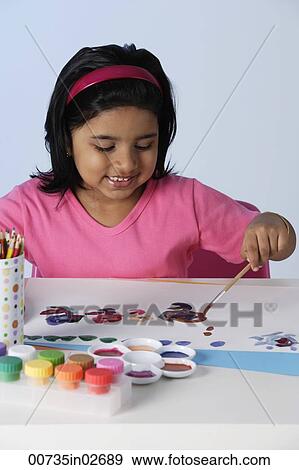 Little girl painting View Large Photo Image Stock Photo - Little girl painting. Fotosearch