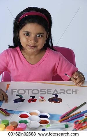 Stock Photo - Little girl painting. Fotosearch