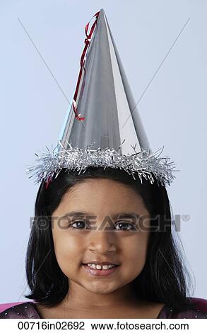 Little girl wearing birthday hat View Large Photo Image Stock Image - Little girl wearing birthday hat. Fotosearch