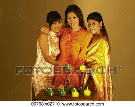 three woman holding oil lamps View Large Photo Image Stock Image - three woman holding oil lamps. Fotosearch
