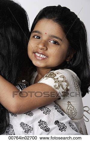 Woman holding little girl View Large Photo Image Stock Image - Woman holding little girl. Fotosearch
