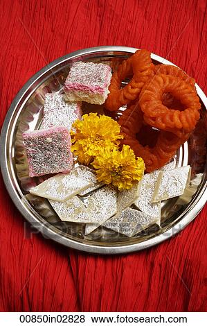 Stock Photo - Assorted Indian sweets on silver tray.. Fotosearch