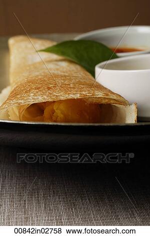 close up of masala dosai, indian food View Large Photo Image Stock Photo - close up of masala dosai, indian food. Fotosearch