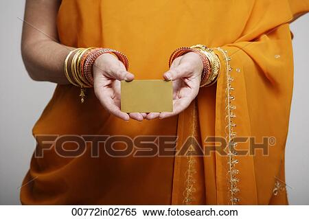 cropped shot of woman wearing sari holding credit card View Large Photo Image Stock Photography - cropped shot of woman wearing sari holding credit card. Fotosearch