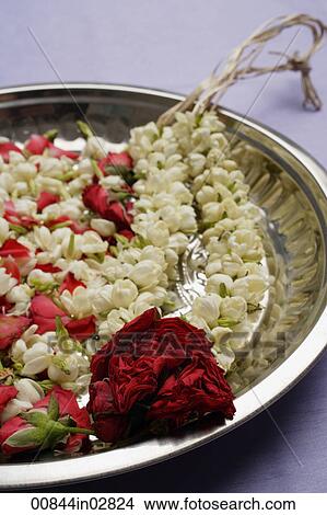 Picture - Flower garland on silver tray. Fotosearch