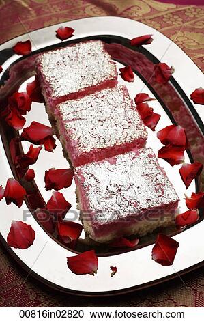 Indian pink sweets on silver tray with rose petals View Large Photo Image Stock Image - Indian pink sweets on silver tray with rose petals. Fotosearch