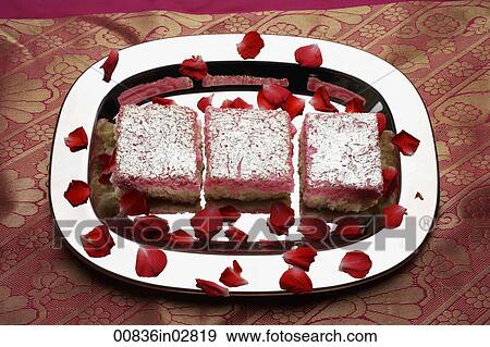 Indian pink sweets on silver tray with rose petals. View Large Photo Image Stock Photo - Indian pink sweets on silver tray with rose petals.. Fotosearch