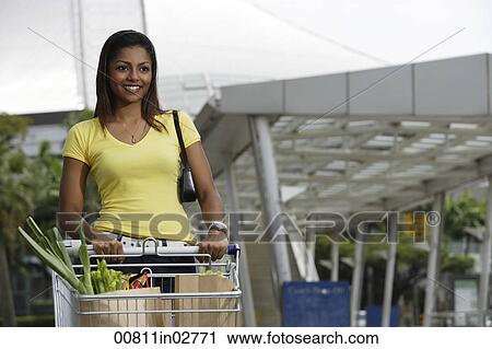 woman pushing shopping cart outside of store View Large Photo Image Stock Image - woman pushing shopping cart outside of store. Fotosearch