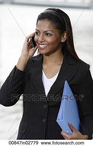 woman wearing business suit talking on phone View Large Photo Image Stock Photo - woman wearing business suit talking on phone. Fotosearch