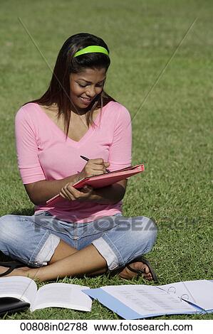 young woman studying outside View Large Photo Image Stock Photo - young woman studying outside. Fotosearch