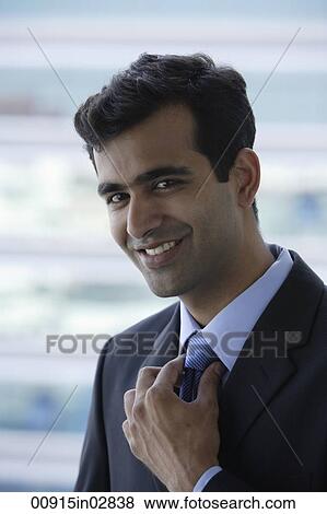 Head shot of Indian businessman smiling. View Large Photo Image Stock Photo - Head shot of Indian businessman smiling.. Fotosearch