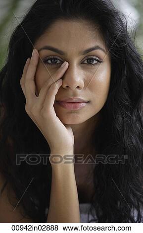 Head shot of Indian woman with hand on her face. View Large Photo Image Stock Photo - Head shot of Indian woman with hand on her face.. Fotosearch